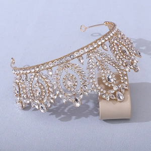 Detailed 45-degree side view of Baroque golden crown with clear crystals and leaf motifs