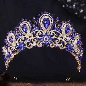 Detailed macro of gold bridal crown with deep blue crystals and rhinestones