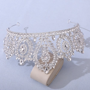 Macro detail of luxury silver bridal crown with intricate baroque leaf-shaped zircons