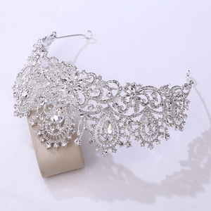 Macro shot of silver bridal crown featuring detailed marquise and teardrop crystal settings