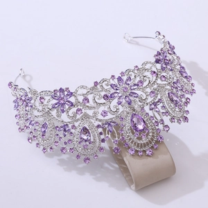 Detail of luxury bridal crown with purple crystals and sparkling rhinestones on silver base