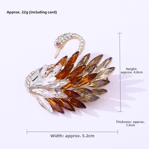 Detailed view of swan brooch dimensions 5.2cm x 4.8cm and 22g weight measurement