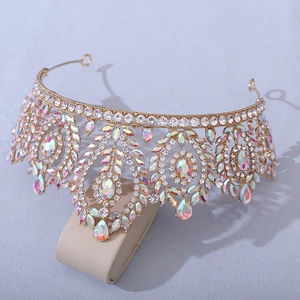 Macro detail of golden baroque crown featuring iridescent AB crystals and rhinestones