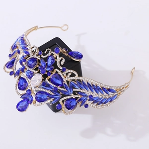 Macro detail of blue crystal baroque crown with golden metal structure and gems