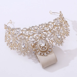 Detailed close-up of a luxury gold bridal crown with shimmering crystals and zircon stones