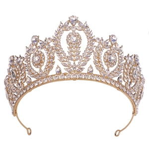 Macro detail of Baroque bridal crown with gold alloy base and shimmering crystal rhinestones