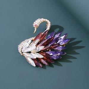 Detail view of gold-plated swan brooch with colorful marquise crystals and sparkling rhinestones