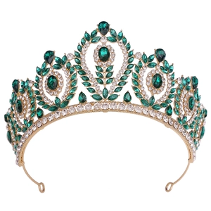 Baroque gold crown for brides featuring emerald gemstones and white crystal detailing