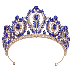Detailed view of the gold baroque bridal crown with blue crystals and white rhinestones
