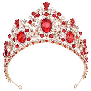 Detailed macro view of the gold alloy frame with red oval gems and floral diamond inlay