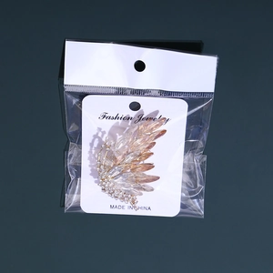 Detailed macro view of an elegant butterfly brooch with crystal and gold finish