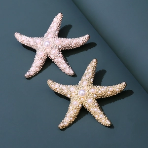 Elegantes broches de estrella de mar dorados y rosa con perlas para estilo playero