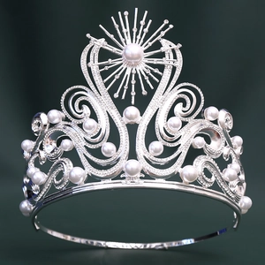 Macro detail of luxury silver bridal crown with white pearls and sparkling rhinestones