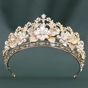 Luxurious gold bridal crown featuring crystal leaf clusters and rhinestones for weddings