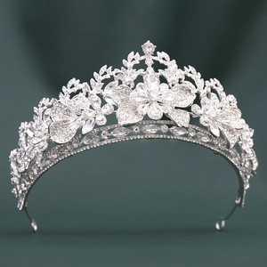 Detailed macro view of luxury silver bridal crown with intricate rhinestone leaf patterns