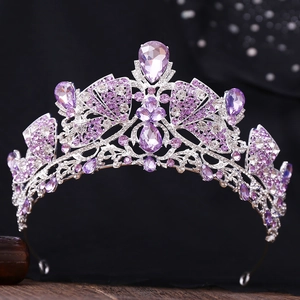 Macro shot of silver bridal crown featuring teardrop purple crystals and rhinestone details
