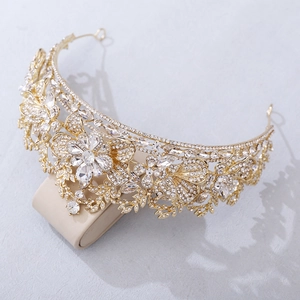 Luxury gold bridal tiara with sparkling crystal leaves and floral rhinestone details