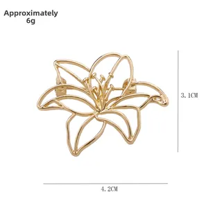 Detailed macro view of hollow lily brooch in gold finish with dimensions 4.2cm by 3.1cm