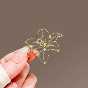 Elegant gold hollow lily flower brooch pin with minimalist floral metalwork for women