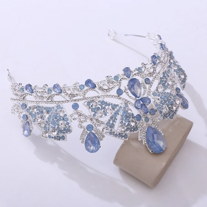 Detail of silver bridal crown featuring blue crystals and marquise rhinestones in Baroque style