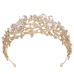 Detailed macro view of the gold hollow floral design and white rhinestones on the crown