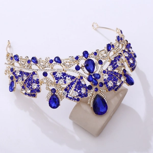 Macro detail of royal crystal bridal tiara with deep blue teardrop rhinestones