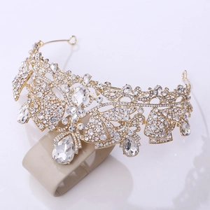 Detailed macro shot of bridal crystal tiara with pear-shaped rhinestones and golden finish