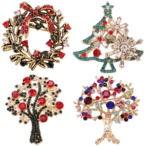 Set de cuatro broches navideños vintage con pedrería, árboles de Navidad y coronas