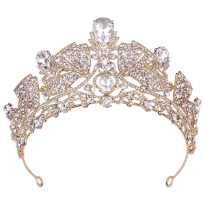 Detail of golden bridal crown featuring large teardrop crystals and sparkling small rhinestones