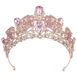 Detailed view of bridal crown with pink crystals and intricate gold alloy structure