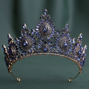 Detail shot of vintage baroque tiara with dark blue sapphire crystals and gold alloy frame