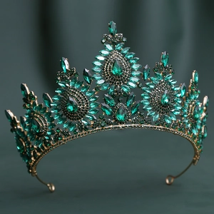 Detail of baroque bridal tiara with emerald green crystals and vintage bronze finish