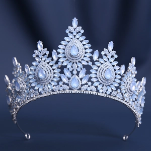 Detailed close-up of a silver baroque tiara with light blue pear-shaped crystals
