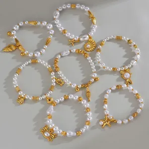 Bracelets de perles élégants avec breloques dorées d'étoile de mer et coquillage