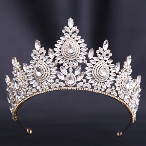 Macro shot of gold bridal crown featuring intricate crystal stone settings and details