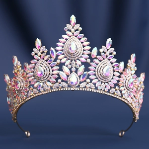 Macro detail of luxury gold bridal tiara with colorful AB crystals and pointed design