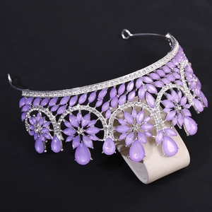 Macro detail of Baroque wedding crown with purple crystals and sparkling teardrop rhinestones