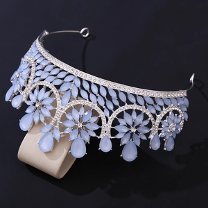 Detailed view of silver bridal crown with light blue crystals and white rhinestones