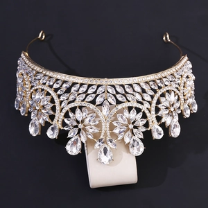 Macro view of golden bridal tiara with marquise and teardrop crystal leaf patterns
