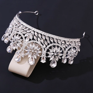 Detailed macro view of crystal wedding tiara with marquise stones on a luxury display stand