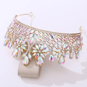 Detailed macro view of golden baroque bridal crown with crystals and iridescent AB gems