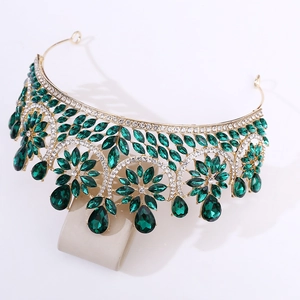 Baroque gold bridal crown with emerald green gemstones and sparkling crystals for weddings