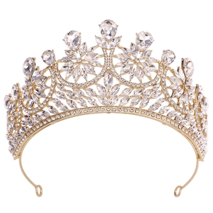 Detailed macro view of gold alloy bridal crown featuring pear-shaped crystals and rhinestones