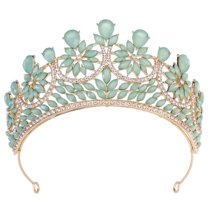 Detailed macro of gold bridal crown with mint green gems and sparkling crystals