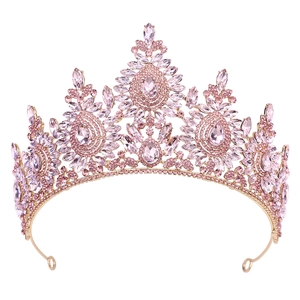 Detailed close-up of pink crystals and gold alloy craftsmanship on the tiara crown