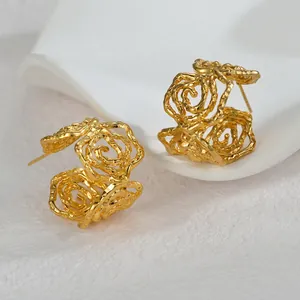 Irregular hollow 18K gold rose flower earrings with layered artistic petal texture