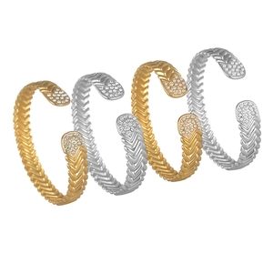 Elegant gold and silver C-shaped open bracelets with chevron texture and zircon inlay