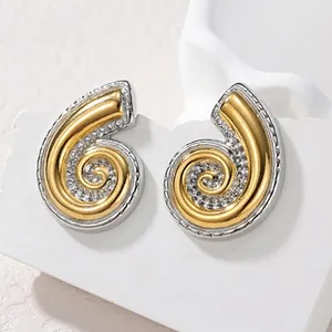 Boucles d'oreilles spirales bicolores or et argent sur support en pierre blanche élégante