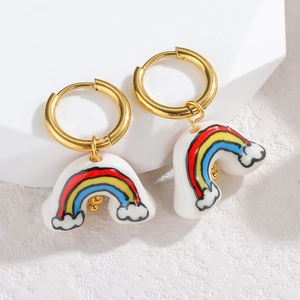 Minimalist stainless steel rainbow cloud earrings with gold hoops on white stone