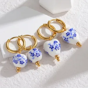Classic blue and white porcelain heart and bead drop earrings with gold hoops